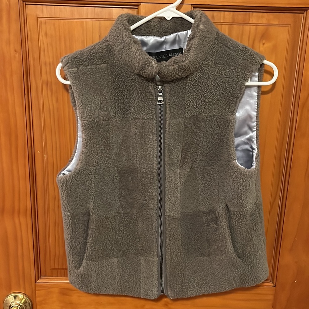 Real sheep fur. Warm vest with zipper.